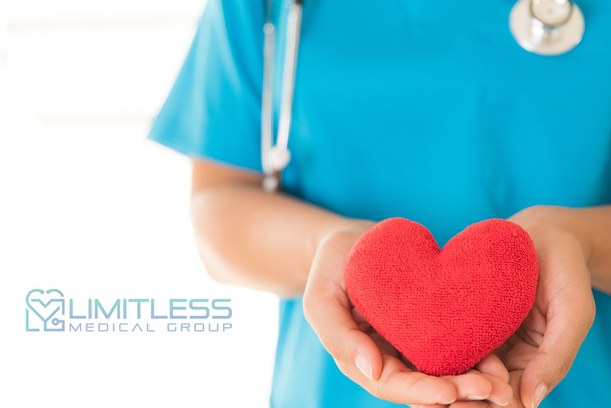 doctor holding a red heart shape, caring